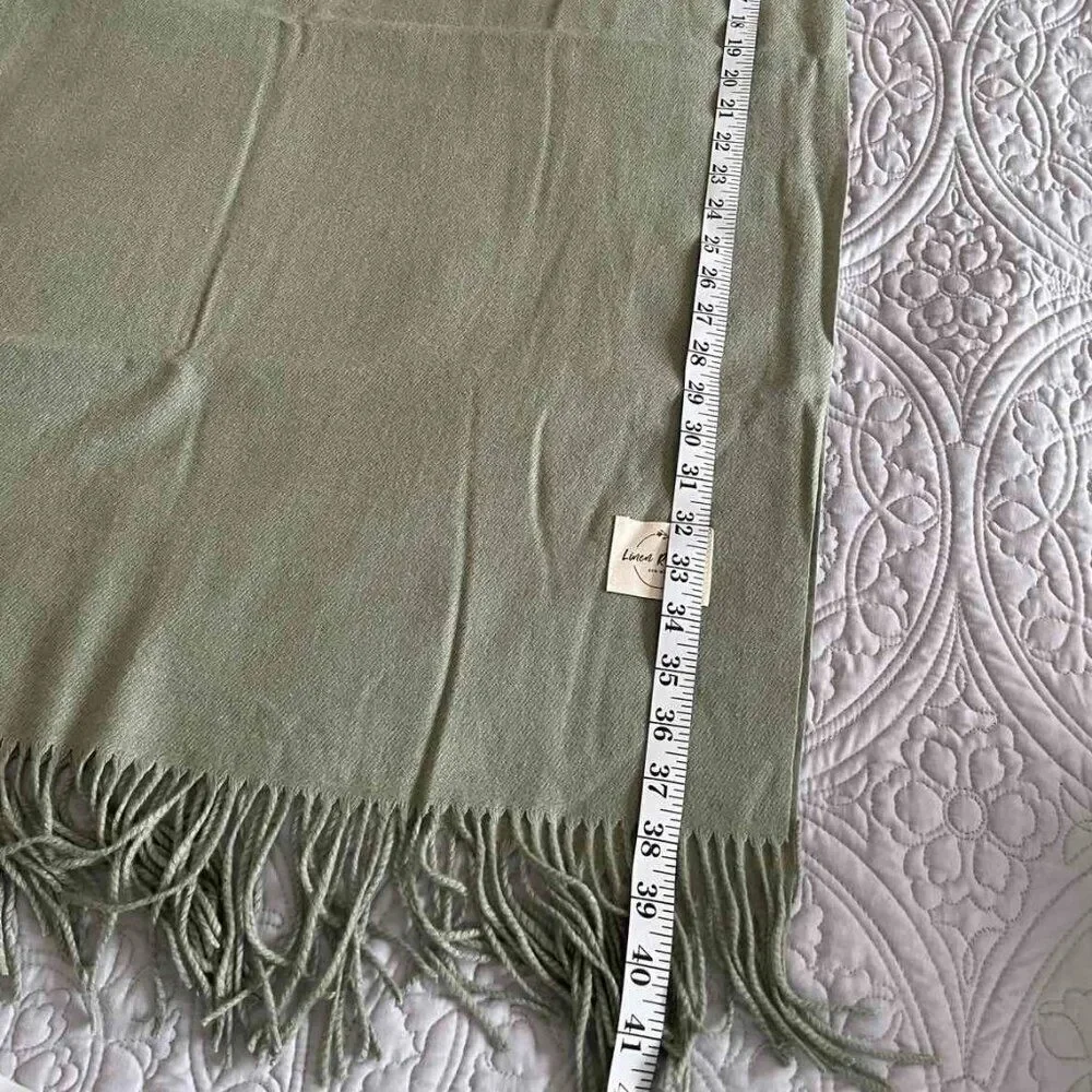 The soft warm pistachio-colored scarve made of a mixture of acrylic and cashmere